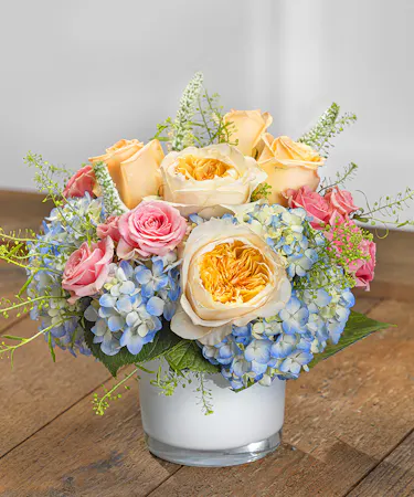 Southern Charm Centerpiece featuring hydrangea, roses and orchids