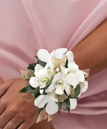 white dendrobium orchid wrist corsage with rhinestones.