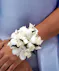 white spray roses and orchids with rhinestones wrist corsage