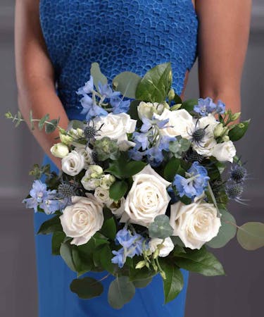 blue hydrangea and white rose boutonniere