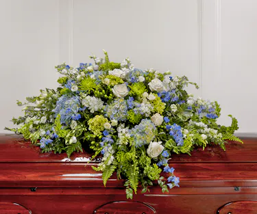 Blue & White Garden Casket Cover by Carithers Flowers featuring roses, hydrangea, orchids and garden florals