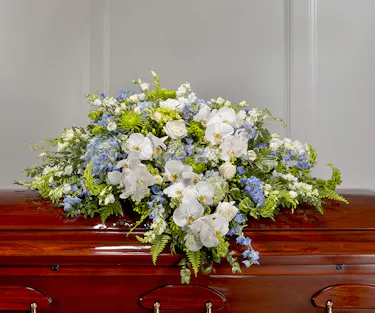 Blue & White Garden Casket Cover by Carithers Flowers featuring roses, hydrangea, orchids and garden florals