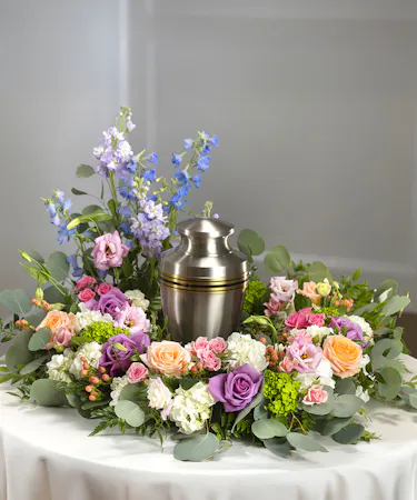 Pastel Garden Floral Cremation Wreath featuring hydrangea, delphinium, roses and seasonal garden flowers