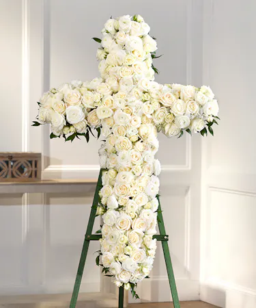 The Elegance Rose Sympathy Cross featuring white roses, ranunculus and white spray roses