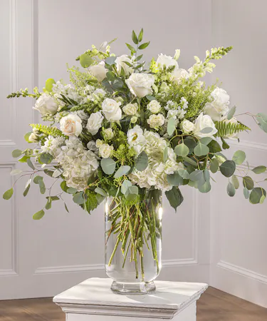 Event Bohemian Pedestal Arrangement in our bloom on bloom style in your choice of color palette.