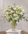 Event Bohemian Pedestal Arrangement in our bloom on bloom style in your choice of color palette.