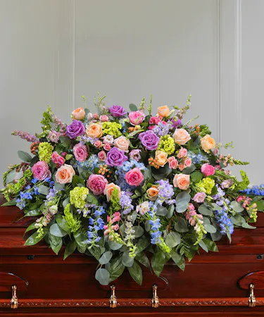 Pastel Garden Floral Casket Cover Blanket featuring hydrangea, roses, delphinium, snapdragons and seasonal foliage.