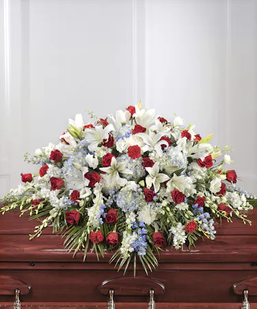 American Patriot Casket Cover featuring red, white, & blue flowers