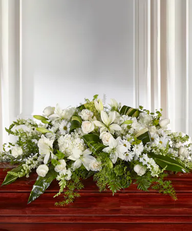 Abundance Floral Garden Casket Cover in White and Ivory featuring hydrangea, lilies and roses