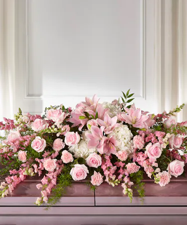 Life & Remebrance Garden Casket Spray featuring white hydrangea, pink roses, lilies and carnations with lush foliage