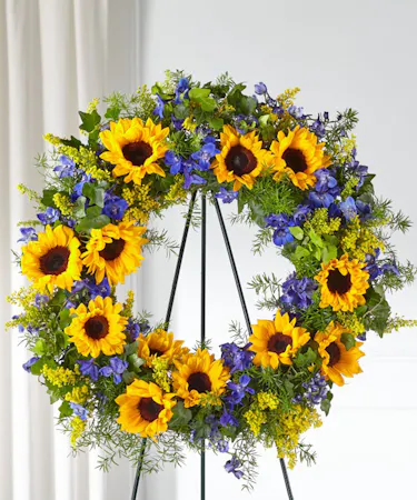 Sunflower Garden Sympathy Wreath featuring sunflowers, delphinium and lush greens