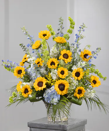 Sunflower Garden Sympathy Basket featuring sunflowers, hydrangea, and eucalyptus
