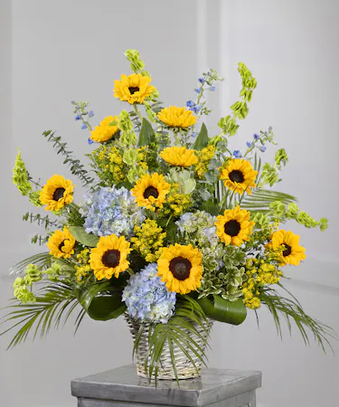 Sunflower Garden Sympathy Basket featuring sunflowers, hydrangea, and eucalyptus