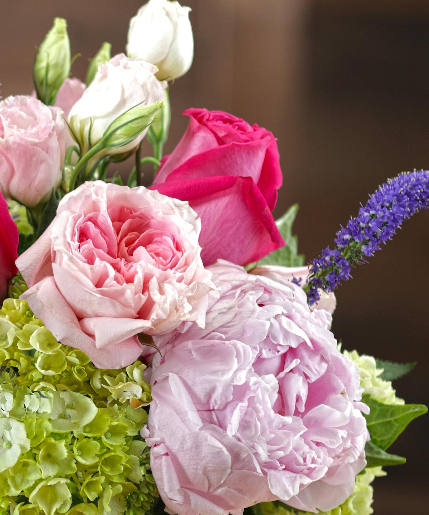 Peony Garden Delights bouquet features pink peony and roses with same