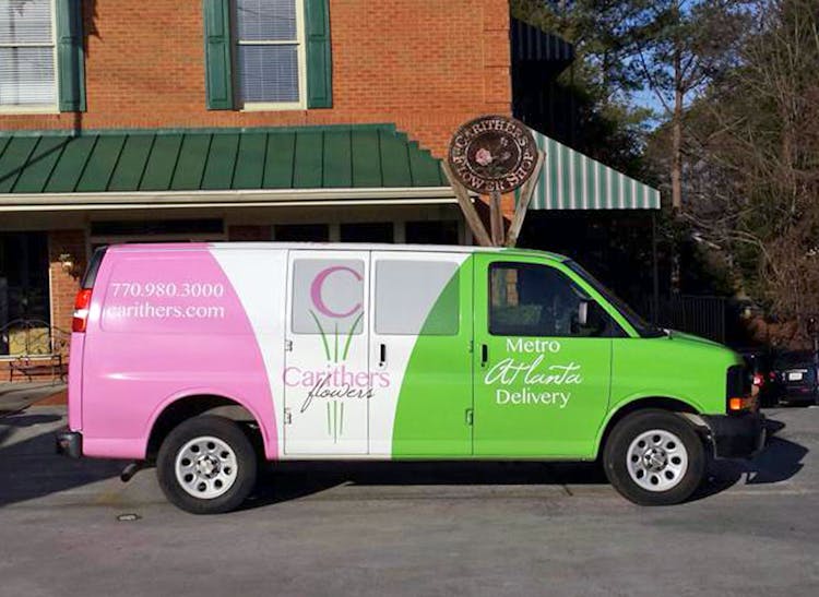 A Carithers-branded delivery van awaits your next order